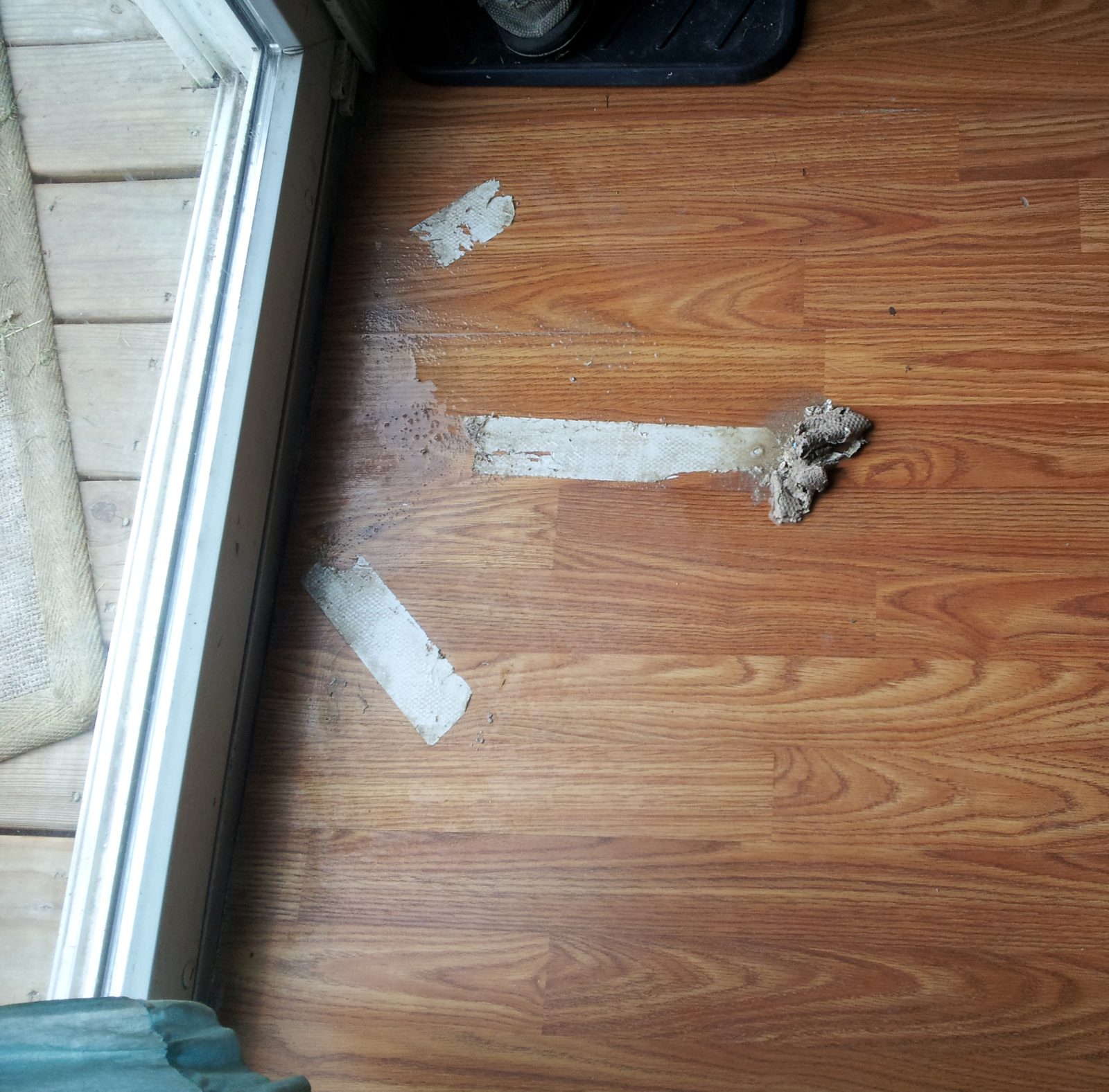 Carpet tape residue before cleaning